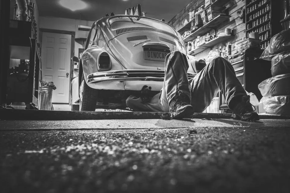 A mechanic workshop with vehicles being serviced